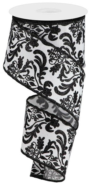 a roll of black and white ribbon on a white background