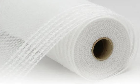 A close-up view of a white, rolled-up piece of fabric or material with a brown circular hole in the center.