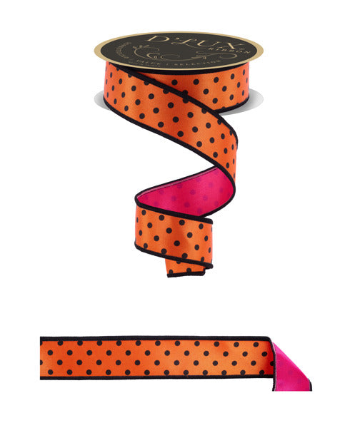 a roll of orange and pink polka dot ribbon