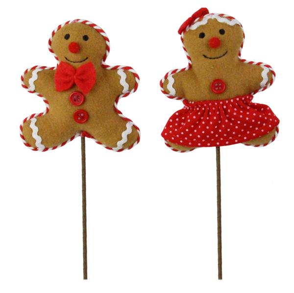 a pair of gingerbread man and woman on a stick