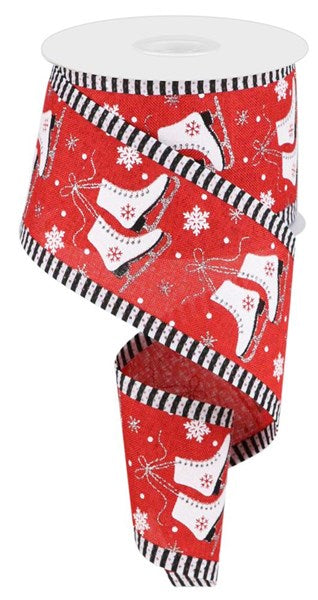 a roll of toilet paper with red and black snowflakes on it