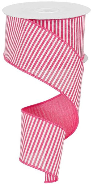 a roll of pink and white striped ribbon