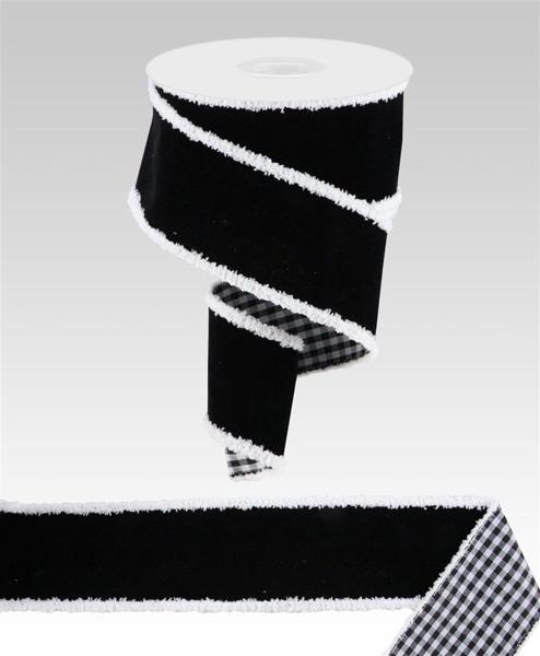 a roll of black and white tape with a checkered design