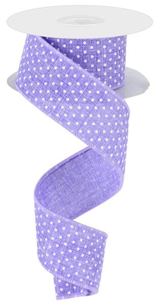 a roll of purple and white polka dot ribbon