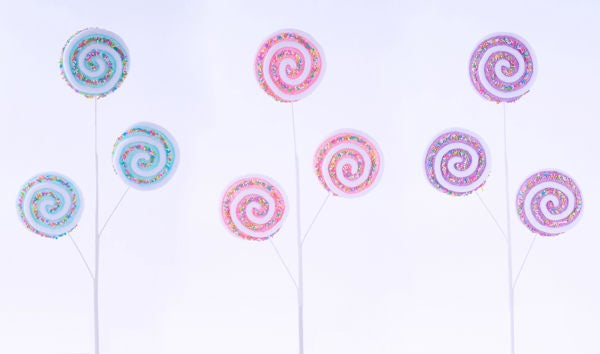 a group of candy lollipops sitting on top of each other