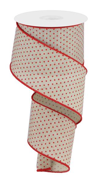 a roll of red and white polka dot ribbon