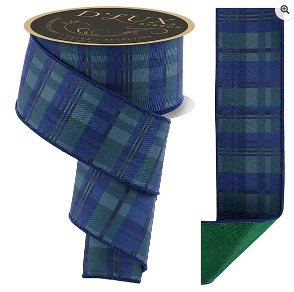 a blue and green plaid ribbon with a gold label, which is a decorative and functional item.