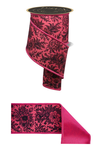 a pink and black ribbon with a flower design on it