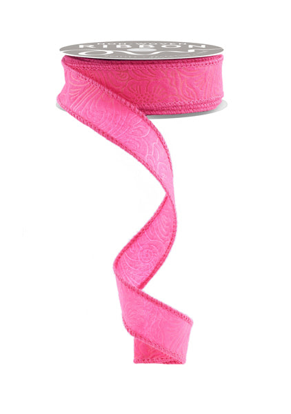 a roll of pink ribbon on a white background