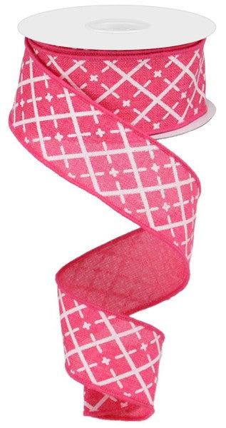 a pink ribbon with white crosses on it