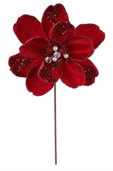 A large, red flower with glittering petals and pearls adorning it.