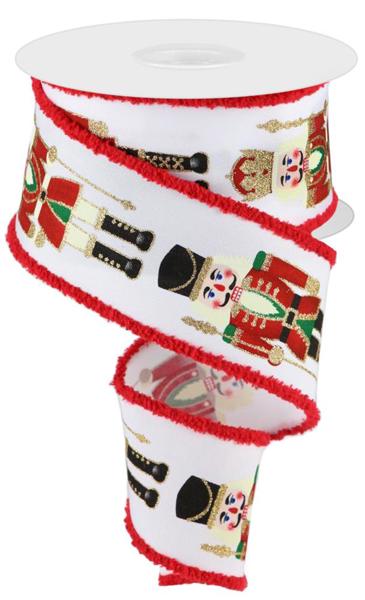 a roll of white christmas ribbon with red trim