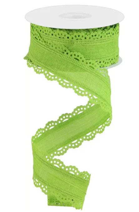 A spool of bright green, scalloped ribbon is shown against a white background.