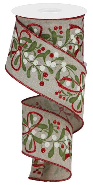 a roll of ribbon with holly and berries on it
