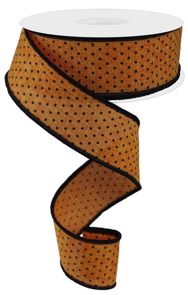 a roll of orange polka dot ribbon on a white background