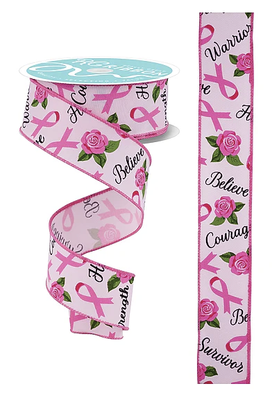 a pink ribbon with a pink rose pattern and the words "Believe" and "Courage" printed on it.