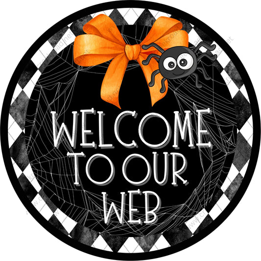 a welcome sign with a spider on it