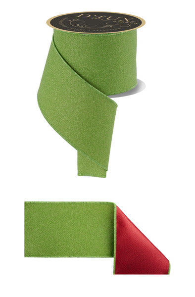 a green and red ribbon, with the green ribbon appearing to be a spool of the same material.