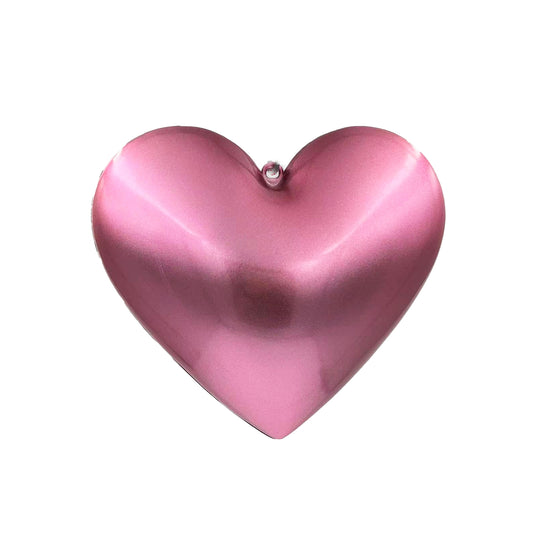 a pink heart shaped object on a white background