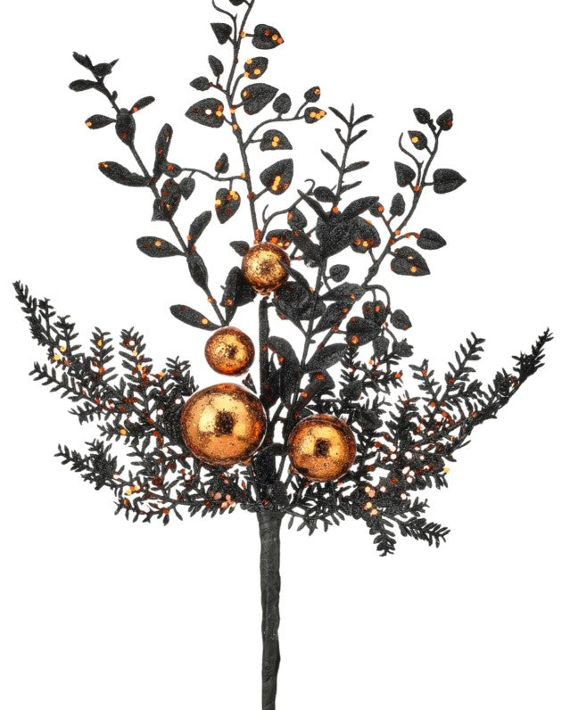 A decorative tree branch with black leaves and golden ornaments, creating a festive and elegant appearance.