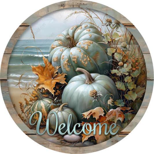 a picture of a welcome sign with pumpkins and leaves