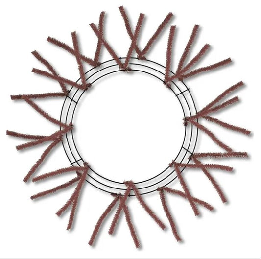 a circular wreath made of brown twigs or branches arranged in a circular pattern.