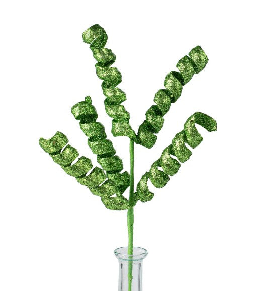 a glass vase with a green plant in it