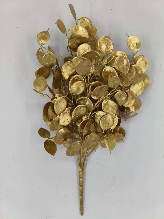 a group of golden, leaf-like objects arranged in a cluster, creating a visually striking and intricate design.
