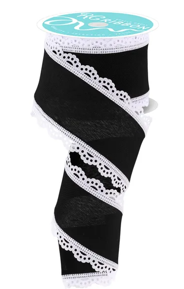 A black and white ribbon with a scalloped edge and lace trim.