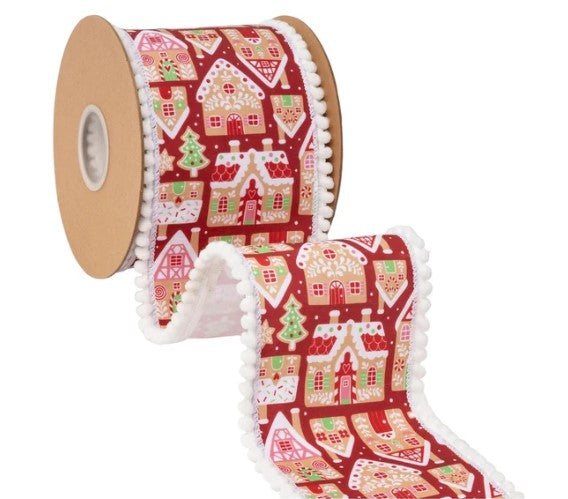 A roll of red and white Christmas-themed ribbon with a repeating pattern of gingerbread houses and snowflakes.