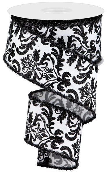 a black and white floral patterned fabric, which appears to be a decorative piece.