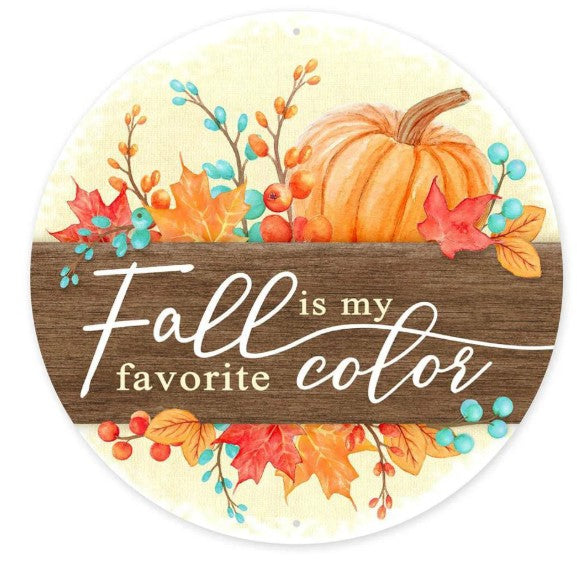 a wooden sign with a pumpkin and autumn leaves, along with the text "Fall is my favorite color" written on it.