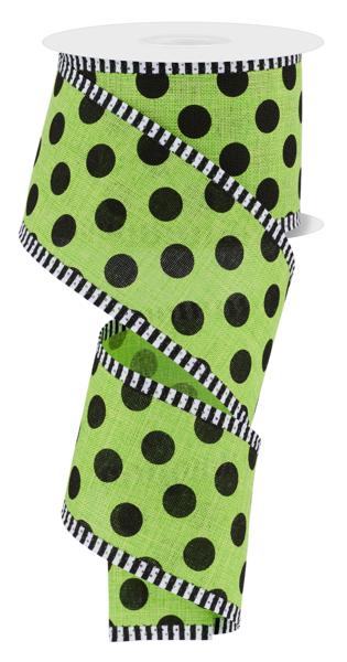 a roll of green and black polka dot ribbon