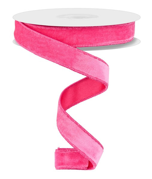 a pink ribbon on a white background