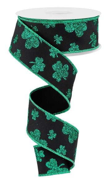 a black and green ribbon with shamrocks on it