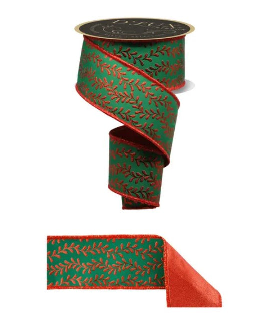 a green and red patterned ribbon with a black top.