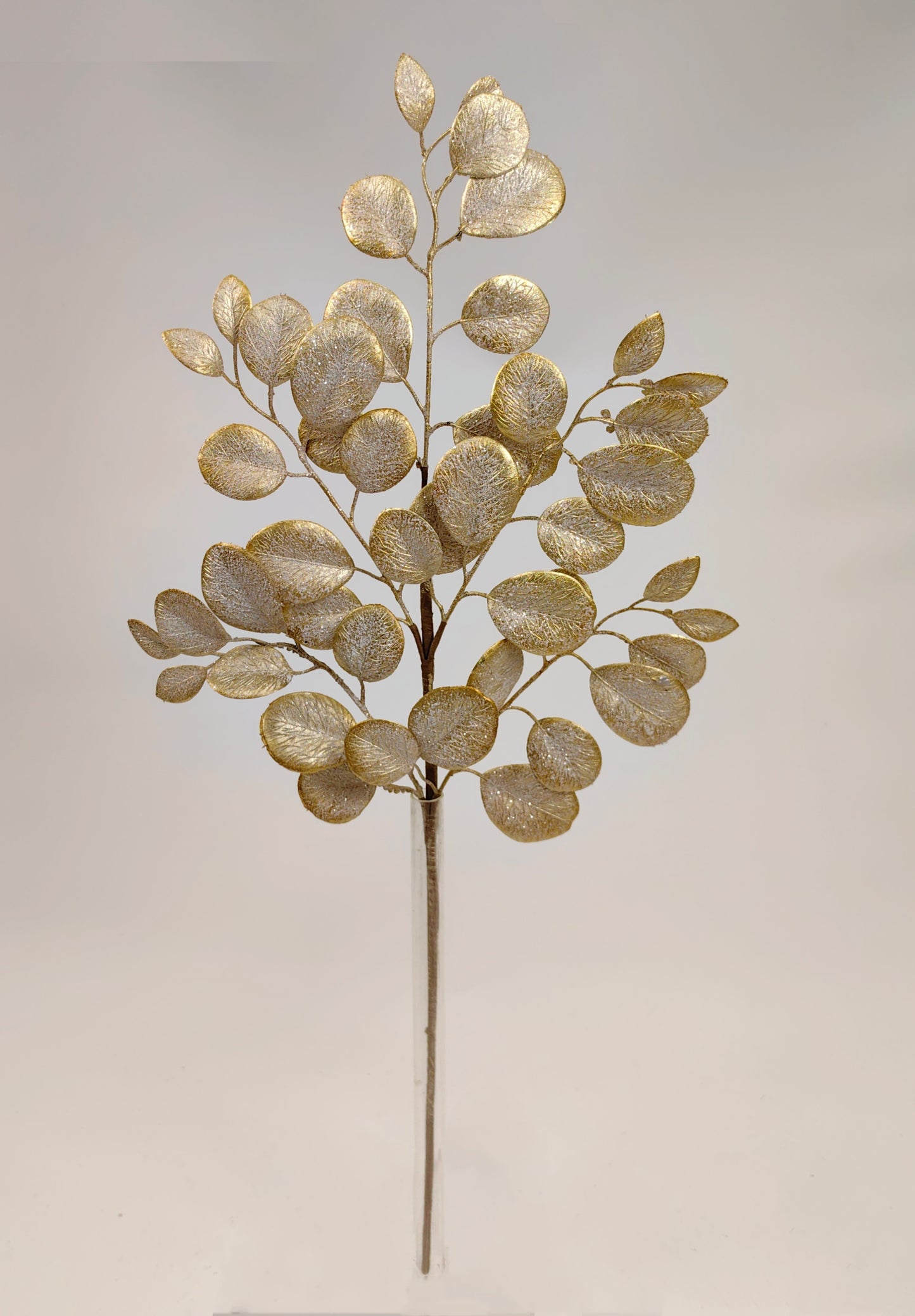 a decorative branch with a golden, leaf-like design.