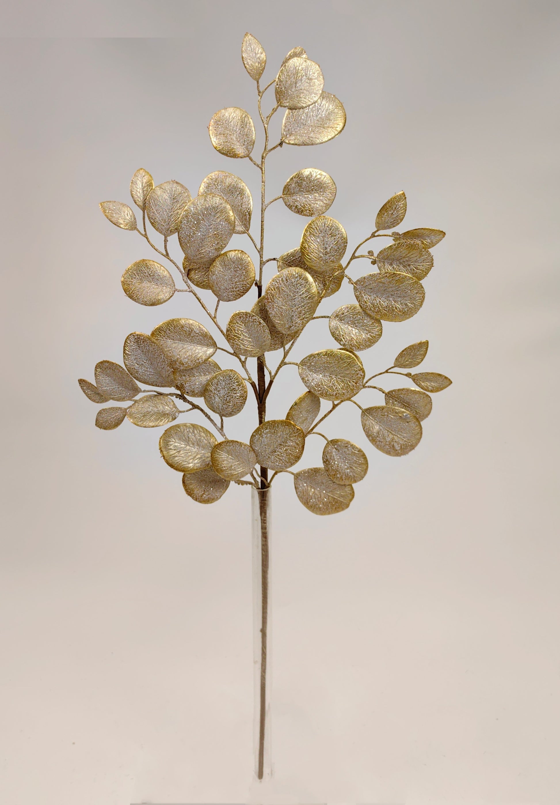 a decorative branch with a golden, leaf-like design.