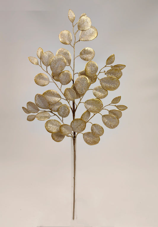 a decorative branch with a golden, leaf-like design.