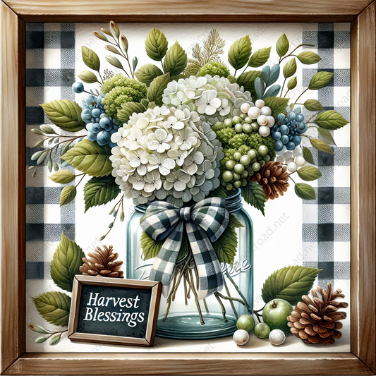 A framed still life depicting a glass jar filled with a bouquet of white hydrangeas, pine cones, and other natural elements, accompanied by a chalkboard sign that reads "Harvest Blessings".