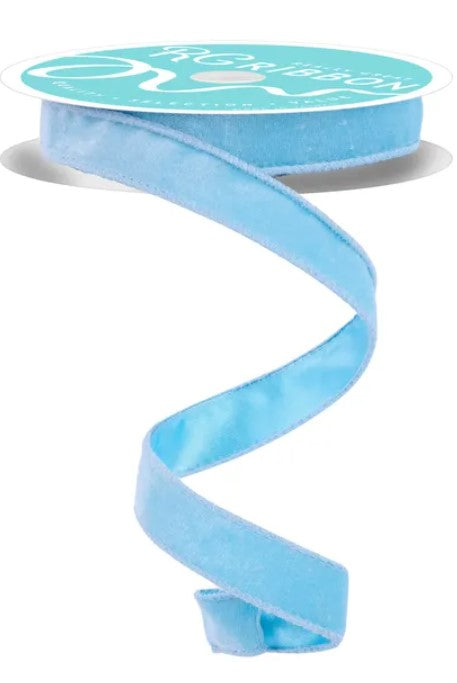 A roll of light blue velvet ribbon with a white label.