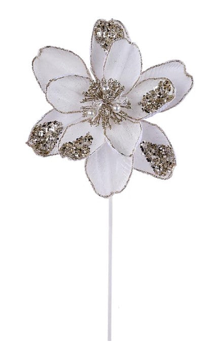A white flower with gold accents, including a large center bloom surrounded by smaller petals.