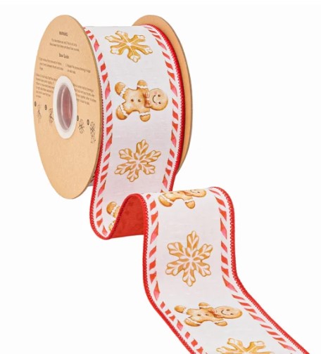 A roll of red and white snowflake-patterned ribbon with gingerbread man designs on it.