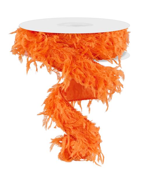 a roll of orange feather on a white table