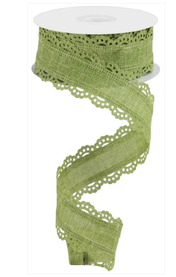A roll of green fabric with a scalloped edge, resembling lace or a decorative trim.