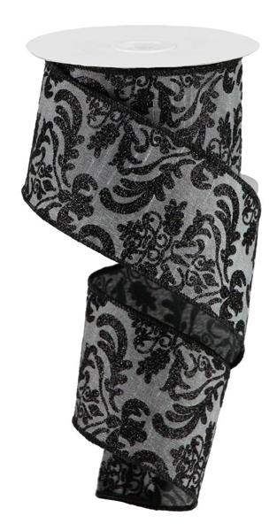 a black and white damask patterned ribbon with a white base.