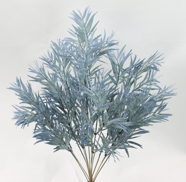 A close-up view of a plant with long, thin leaves in a light blue color.