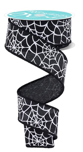 A spool of black and white spider web ribbon with a teal-colored backing.