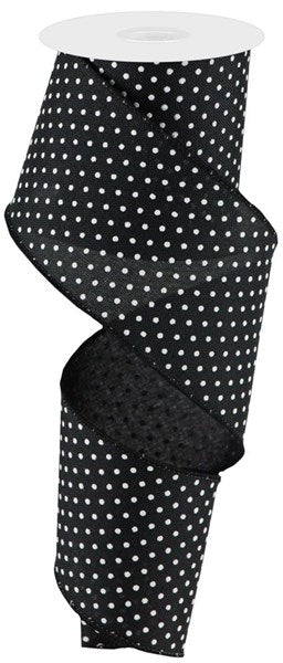 a roll of black and white polka dot ribbon