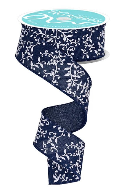 A roll of dark blue and white floral patterned ribbon.